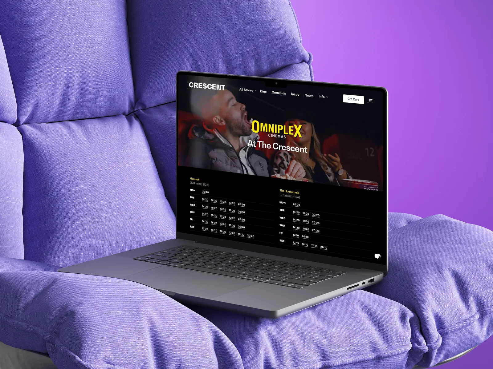 Laptop displays cinema website design for movie listings, reflecting website design.