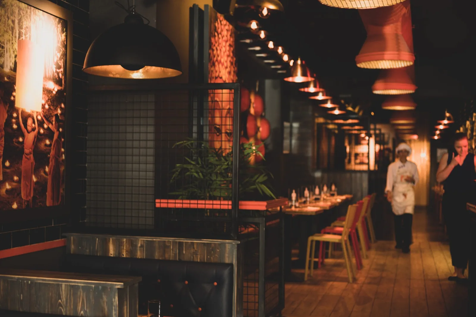 Restaurant dining area with warm lighting, showcasing ambiance for website design.