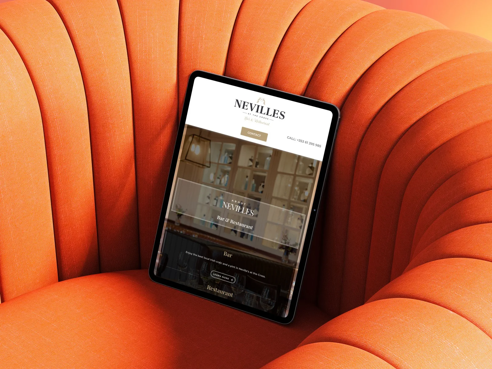 website design for Nevilles Bar & Restaurant displayed on a tablet.