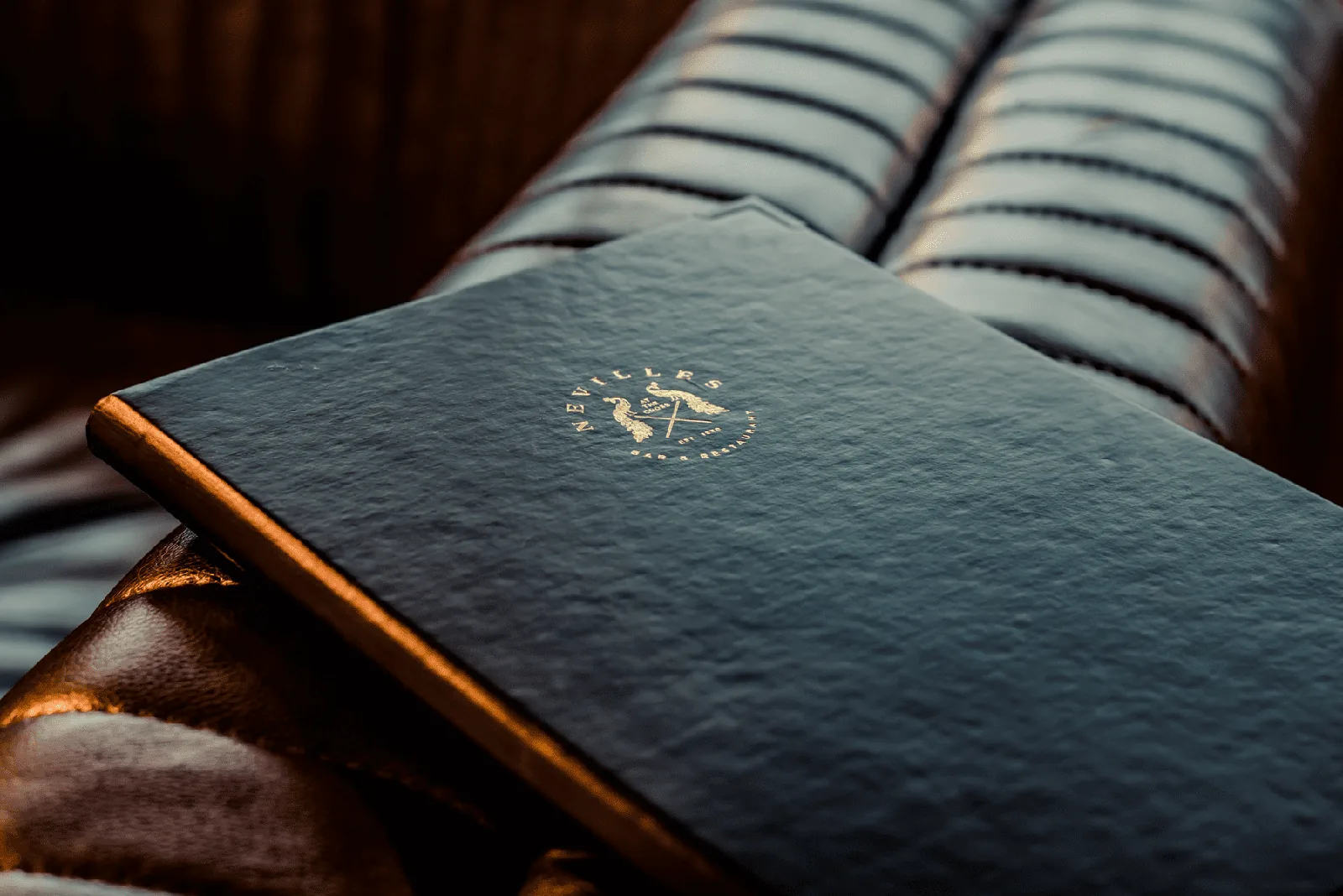 Nevilles Bar & Restaurant menu showcasing brand identity design.