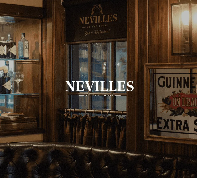 Nevilles at The Cross brand identity design in a traditional bar setting.