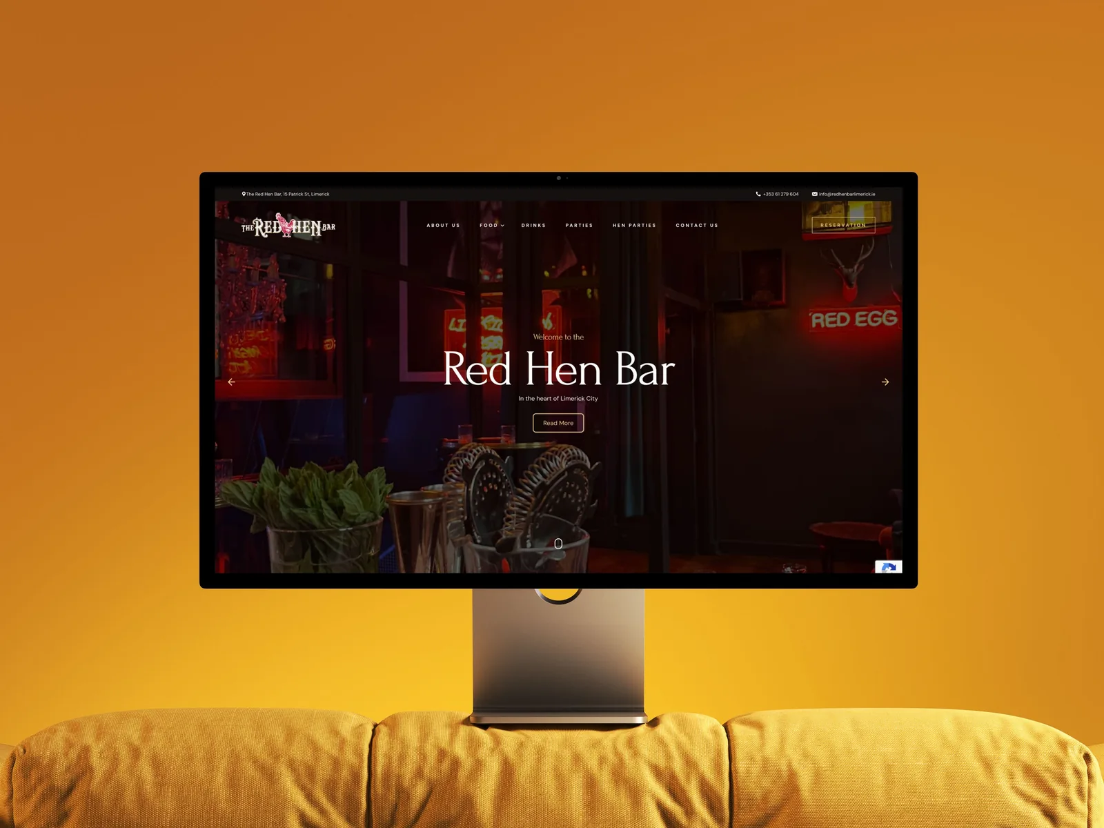 Bar website design for The Red Hen Bar on a monitor.