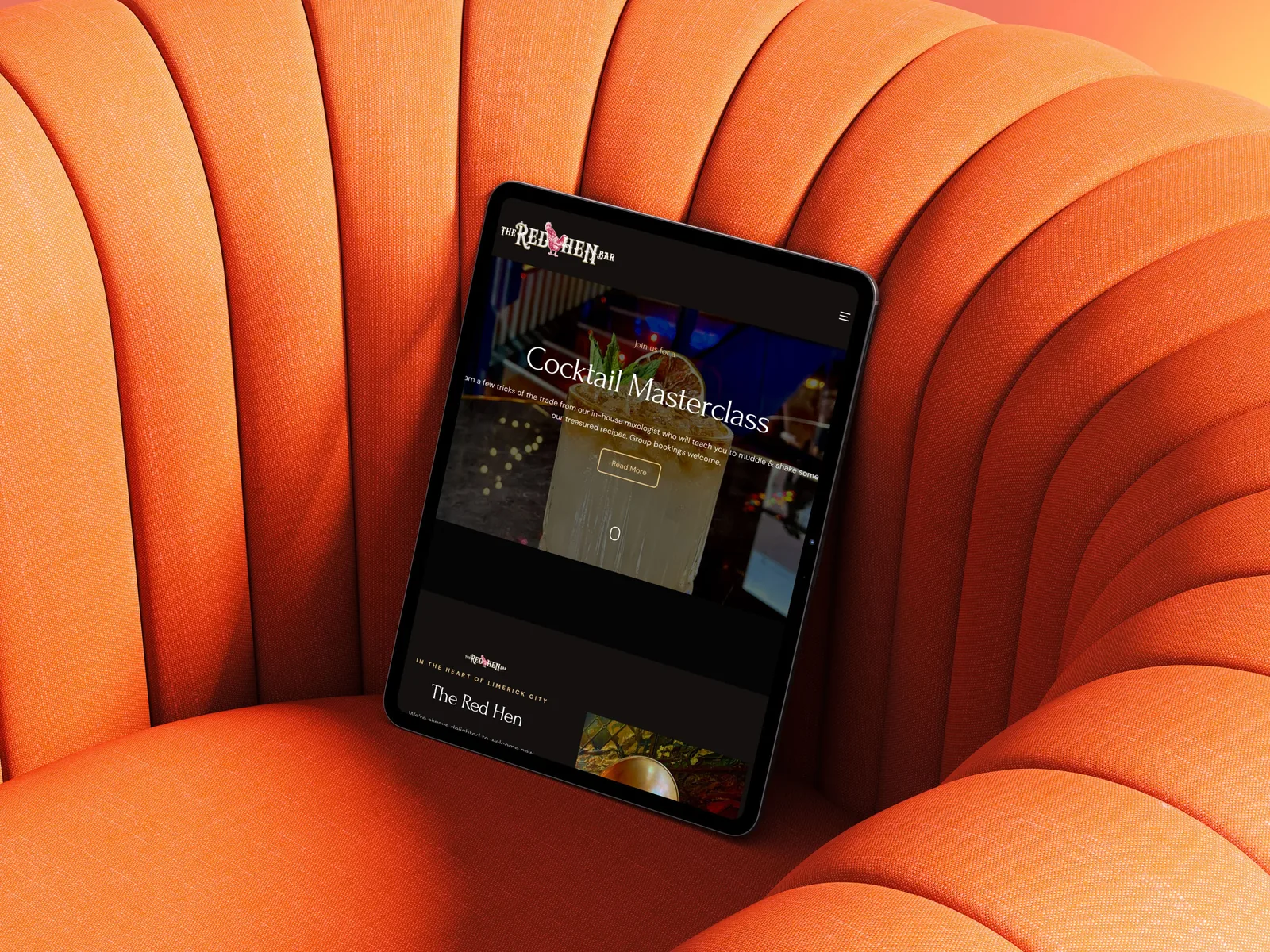Tablet showing Red Hen Bar website, a strong website design example.