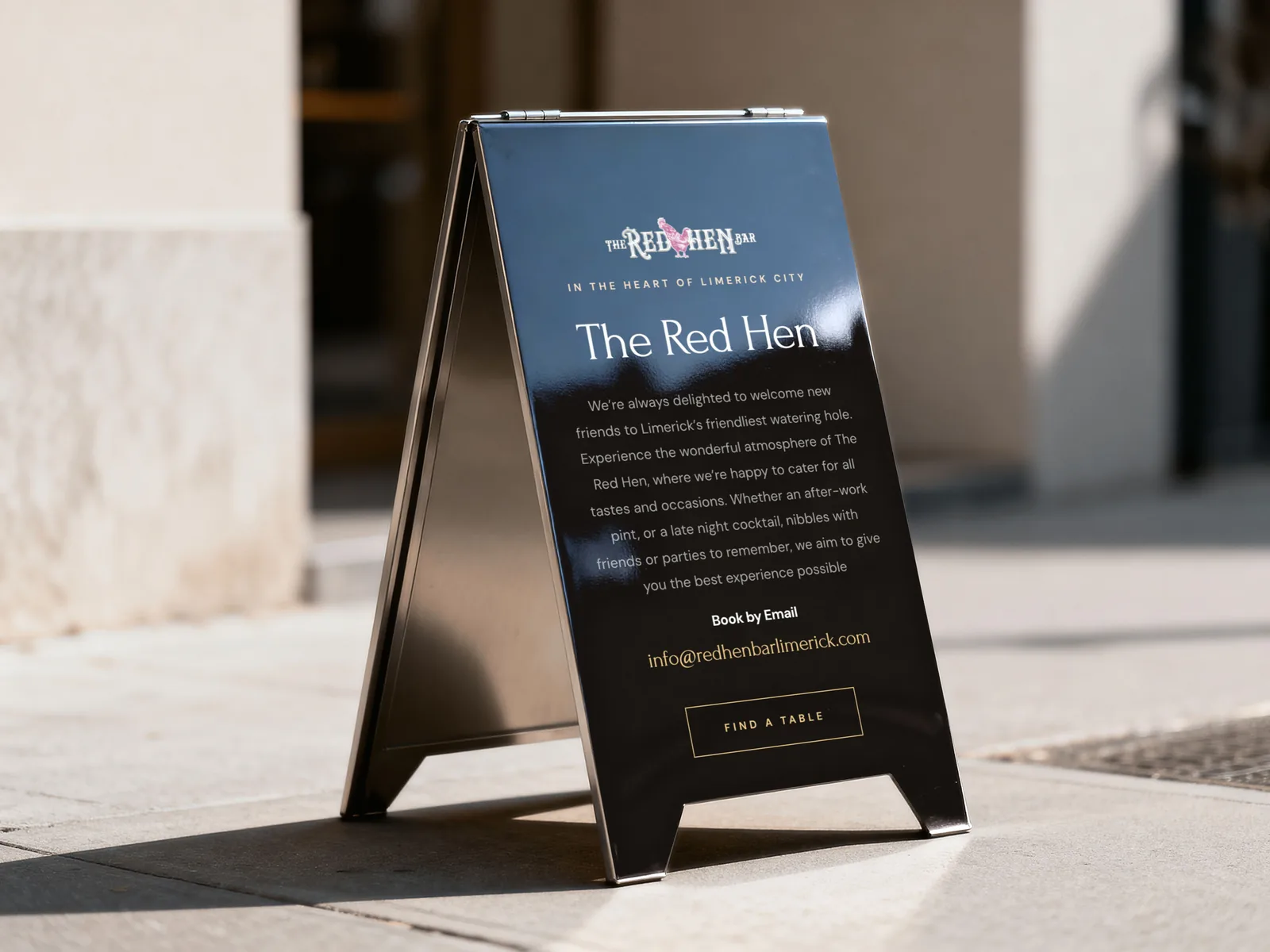 A-board sign for The Red Hen Bar with 'Find a Table' CTA for website design.